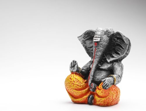 antique lord ganesha sculpture on white background. antique lord ganesha sculpture on white background.